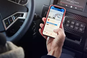 Driver viewing Renault Trucks social networks on mobile