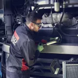 Man repairing trucks