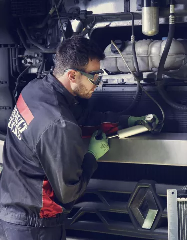 Man repairing trucks
